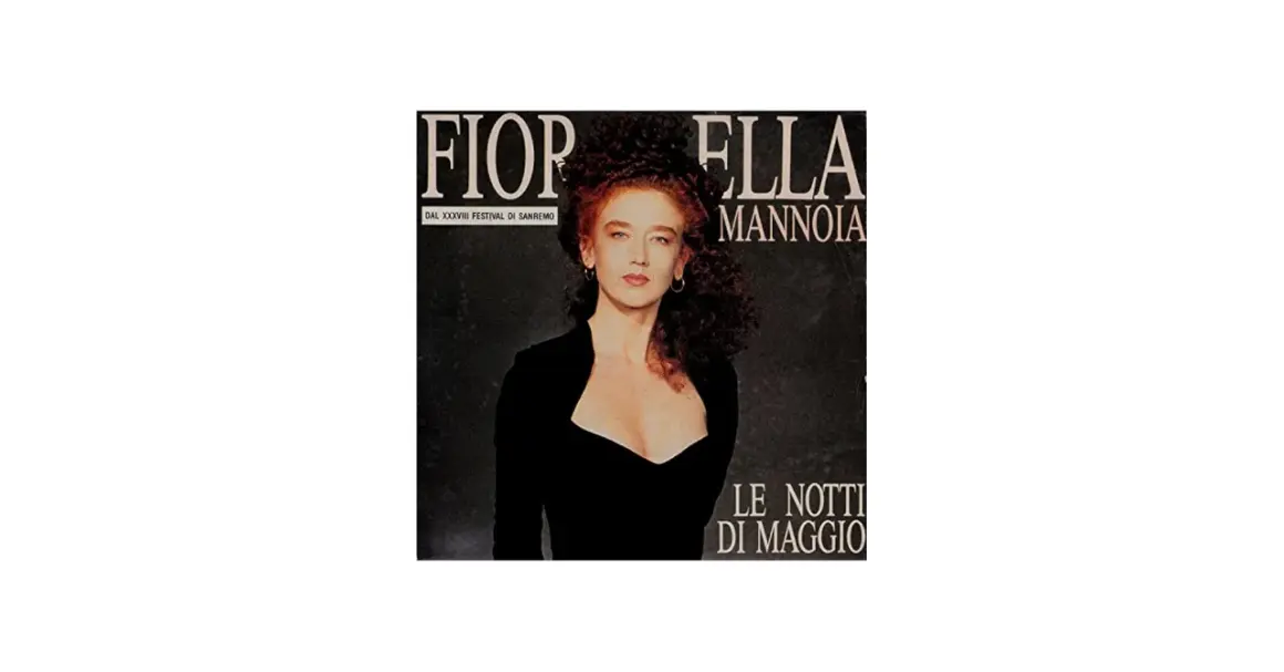 Fiorella Mannoia, con il suo look iconico, interpreta "Le notti di maggio" in un'immagine che evoca la magia del Festival di Sanremo.