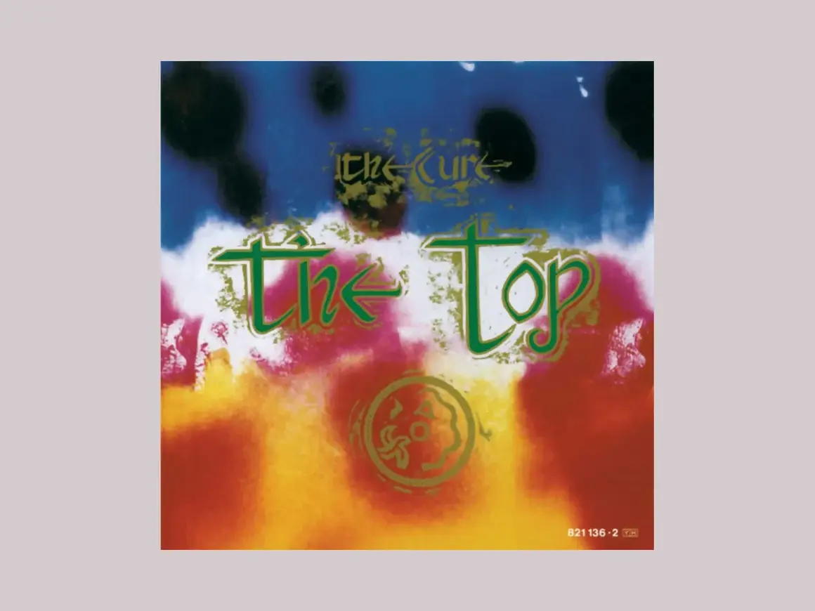 Copertina psichedelica dell'album di The Cure "The Top", con colori vivaci e testo verde.